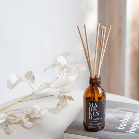 MadeKind Awaken aromatherapy reed diffuser in glass amber bottle. Pure essential oil blend includes Lemon, Eucalyptus and peppermint. Reeds come included and presented in a Kraft gift  box.