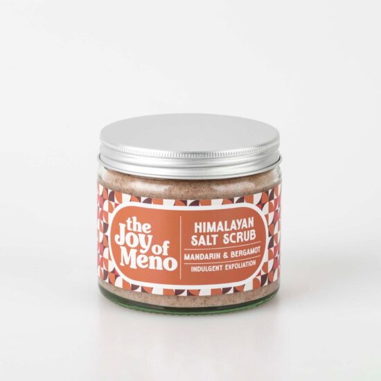 photo of a clear glass jar containing a pink coloured salt scrub for menopausal dry skin